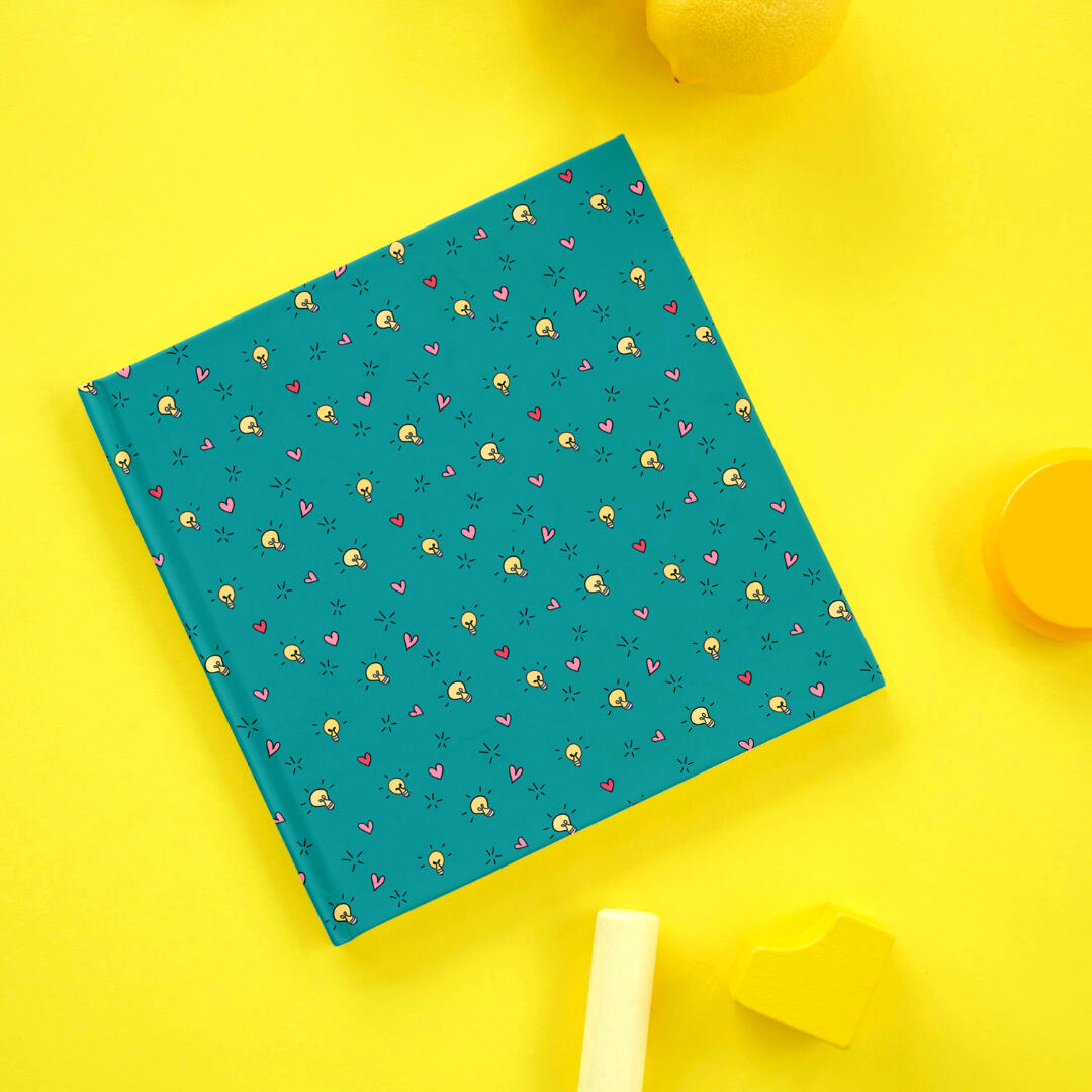 Whimsical, yellow lightbulbs and red and pink heart pattern on a teal green background - Yemisi Olusanya